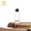 Frasco de perfume redondo de 100 ml con tapas de bola negras