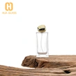 Botella de perfume rectangular de vidrio de 60 ml, 80 ml y 100 ml con tapa de piedra dorada
