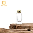 Botella de perfume rectangular de vidrio de 60 ml, 80 ml y 100 ml con tapa de piedra dorada
