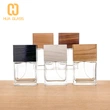 Frasco de perfume de vidrio negro de cubo cuadrado de 100 ml con tapa de madera negra