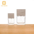 Frasco de perfume de vidrio negro de cubo cuadrado de 100 ml con tapa de madera negra