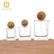 Frasco de perfume de vidrio cuadrado de 30 ml, 50 ml, 100 ml con tapa redonda de madera