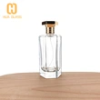 Frasco de perfume con tapa de zamak de vidrio transparente en forma de octágono de 100 ml