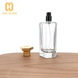 Frasco de perfume con tapa de zamak de vidrio transparente en forma de octágono de 100 ml