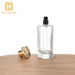 Frasco de perfume con tapa de zamak de vidrio transparente en forma de octágono de 100 ml