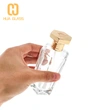 Frasco de perfume con tapa de zamak de vidrio transparente en forma de octágono de 100 ml