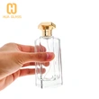 Frasco de perfume con tapa de zamak de vidrio transparente en forma de octágono de 100 ml