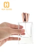 Botella de perfume con tapa de zamak de oro rosa de vidrio pulido a mano rectangular de 50 ml
