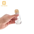 Tapa de madera personalizada 50ml 100ml botella de perfume de vidrio redonda cilíndrica