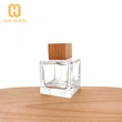 Botella de perfume cuadrada de 100 ml con tapa de madera/tapa de abs