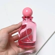 Frasco de perfume rosa transparente de vidrio de 100 ml con tapa de bola