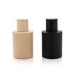 Frasco de perfume redondo beige negro mate de vidrio de 50 ml con tapa