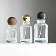 Venta al por mayor botella de perfume redonda de vidrio de 30 50 100 ml con tapa de bola