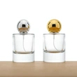 Frasco de perfume redondo de vidrio transparente de lujo de 50 ml con tapa de bola