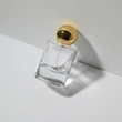 Frasco de perfume redondo de vidrio transparente de lujo de 50 ml con tapa de bola