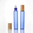 cosmetic package glass perfume roll on bottles with plastic bamboo cap