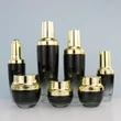 black skincare cosmetic glass bottle set with pump lotion cap