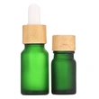 cosmetic oil serum white glass bottle with bamboo dropper cap