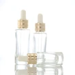 oil dropper bottle  transparent glass bottle  gold lid glass bottle