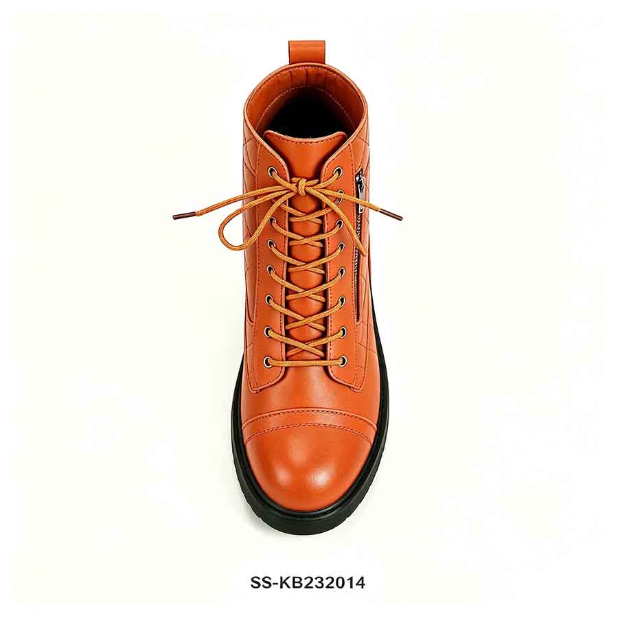 1789876462972121.jpg Top down shot of orange lace up quilted kids combat boot