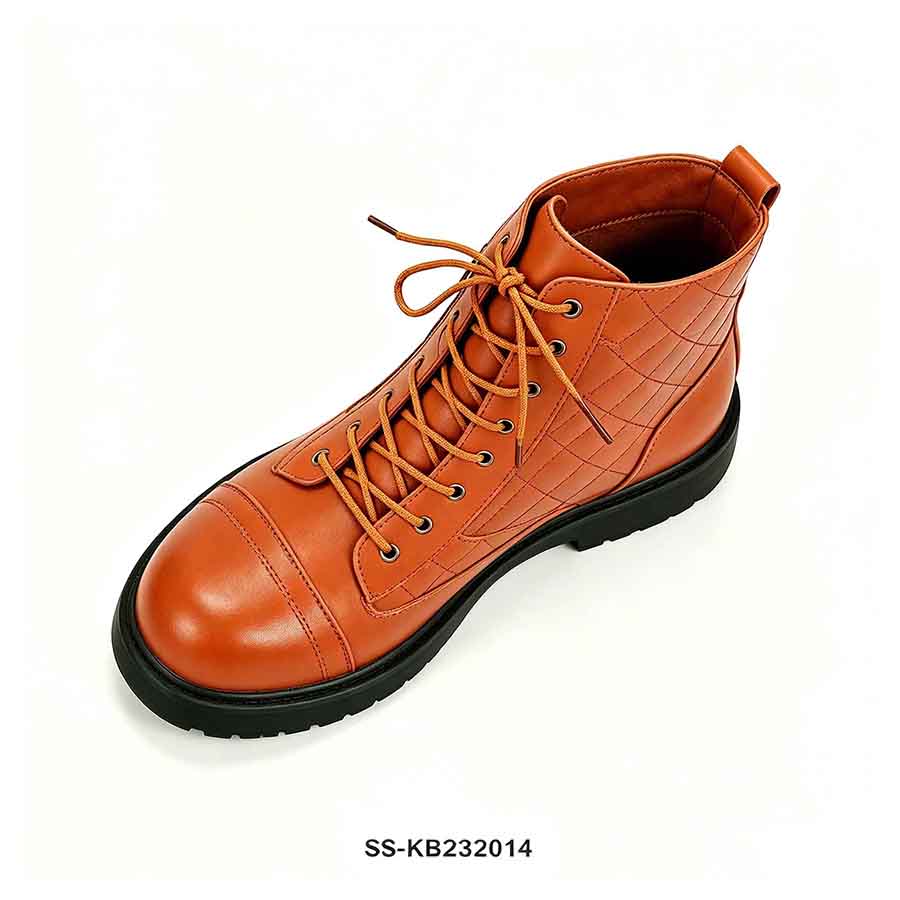 1789876476945250.jpg Overhead side view of orange quilted kids combat boot with cap toe