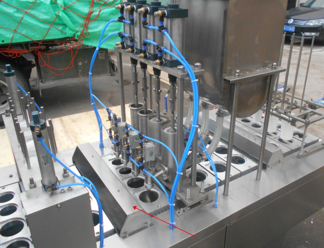 four cup filling machine.jpg