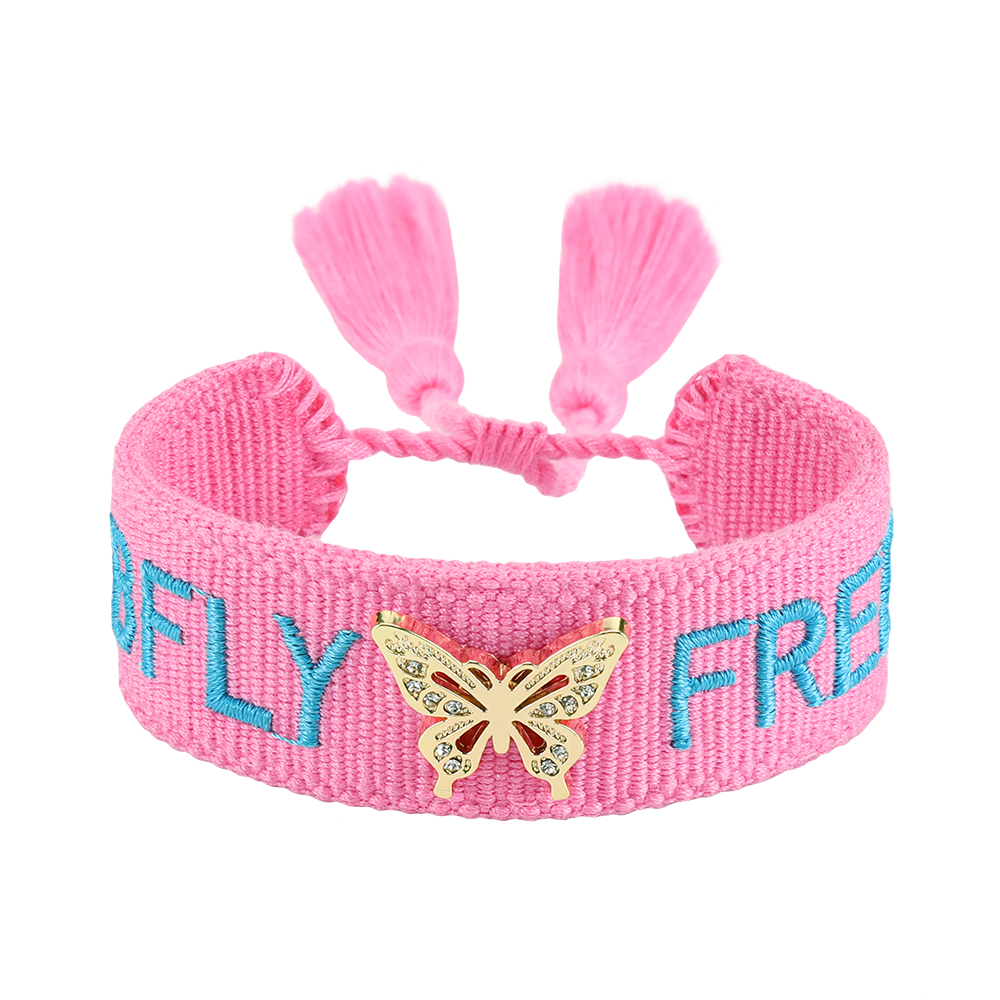 Tassel bracelets featuring embroidered words and decorative charms- rose, butterfly, clover, and bow