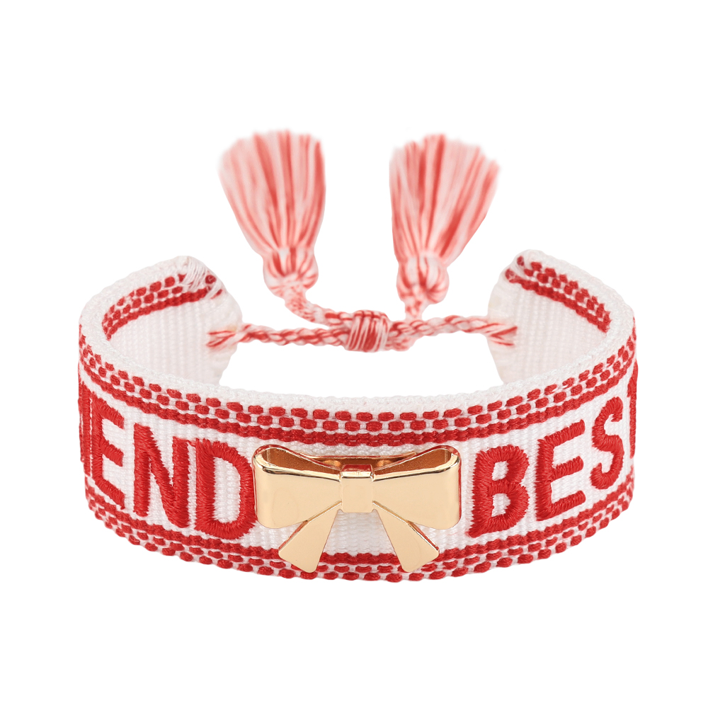 Tassel bracelets featuring embroidered words and decorative charms- rose, butterfly, clover, and bow