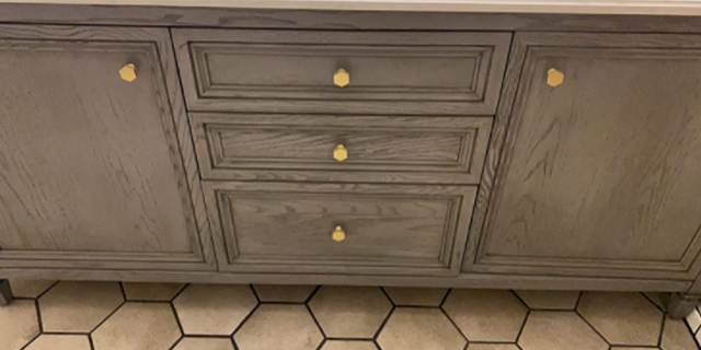 A simple remodel idea - The QogriSun solid brass hex knob matches perfectly with hexagonal floor tiles.