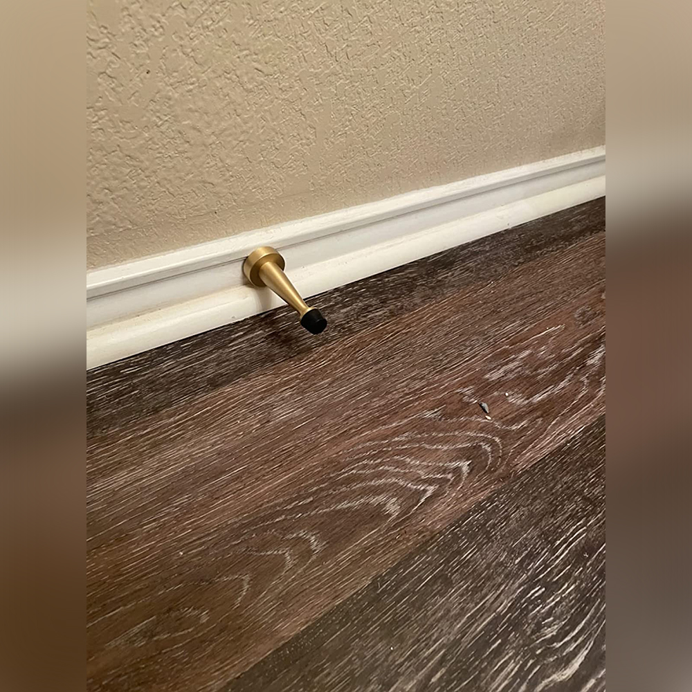 Use brass door stopper elevated door and wall quality.