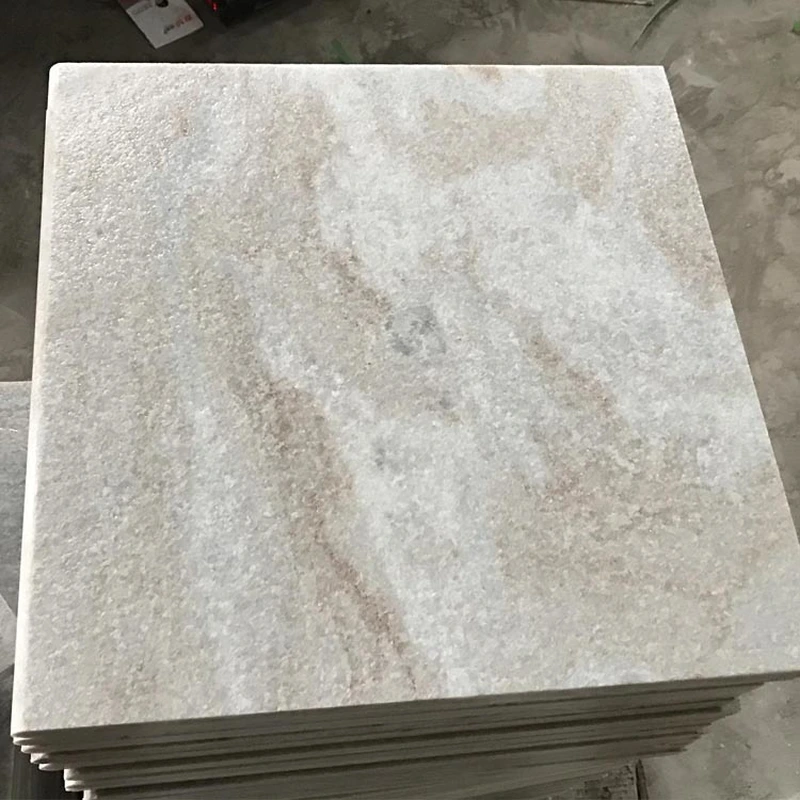 white quartz pool surrounding flamed paving tiles