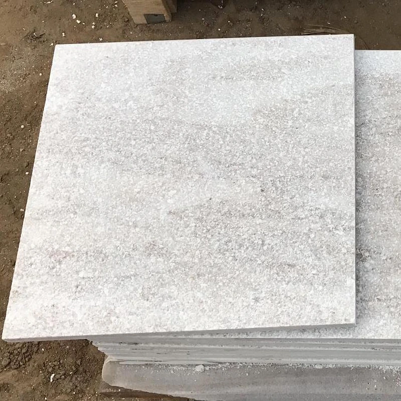 white quartz pool surrounding flamed paving tiles