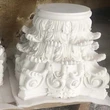 white marble stone pillars caps