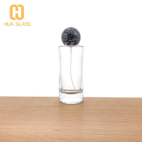 Frasco de perfume redondo de 100 ml con tapas de bola negras