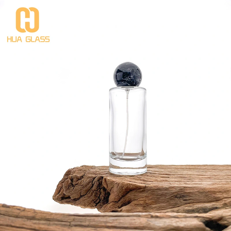 Frasco de perfume redondo de 100 ml con tapas de bola negras  