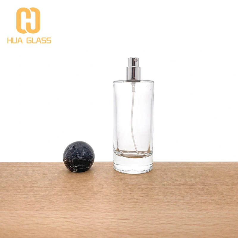 Frasco de perfume redondo de 100 ml con tapas de bola negras  