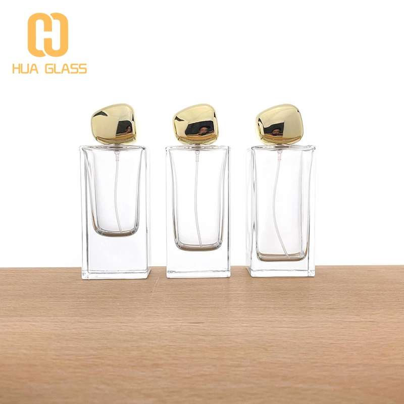 Botella de perfume rectangular de vidrio de 60 ml, 80 ml y 100 ml con tapa de piedra dorada  
