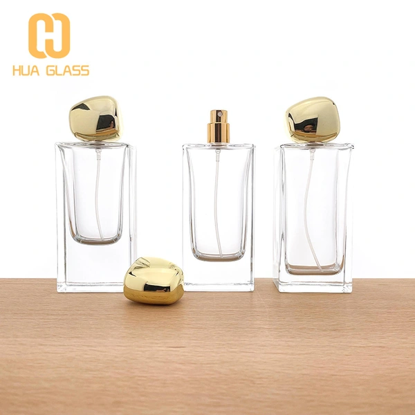 Botella de perfume rectangular de vidrio de 60 ml, 80 ml y 100 ml con tapa de piedra dorada