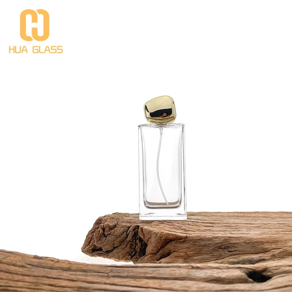 Botella de perfume rectangular de vidrio de 60 ml, 80 ml y 100 ml con tapa de piedra dorada