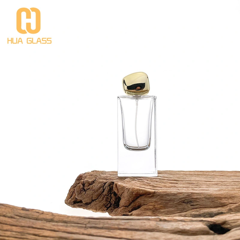 Botella de perfume rectangular de vidrio de 60 ml, 80 ml y 100 ml con tapa de piedra dorada  