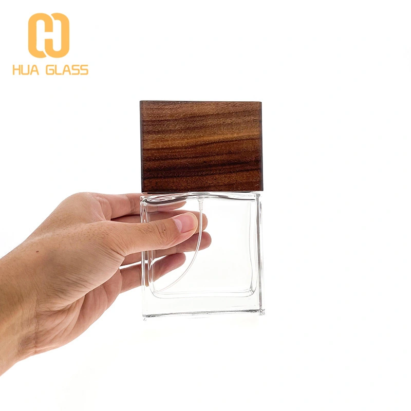 Frasco de perfume de vidrio negro de cubo cuadrado de 100 ml con tapa de madera negra  