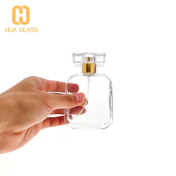 Flacon de parfum en verre à capuchon en cristal transparent de forme carrée ovale de 100 ml