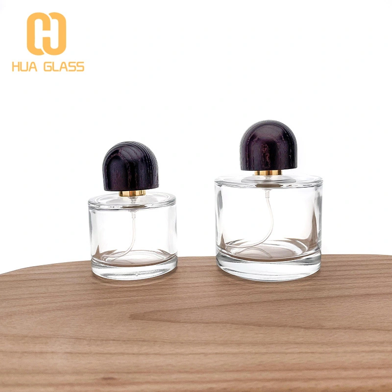 Frasco de perfume de vidrio redondo pequeño de 50 ml y 100 ml con tapa de madera  