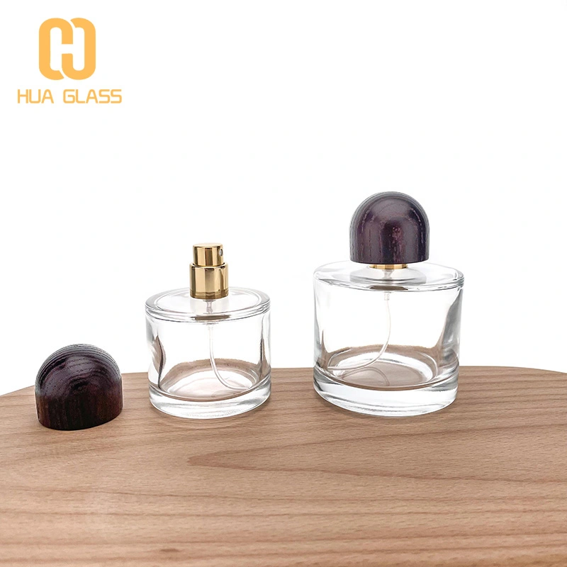 Frasco de perfume de vidrio redondo pequeño de 50 ml y 100 ml con tapa de madera  
