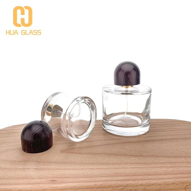 Frasco de perfume de vidrio redondo pequeño de 50 ml y 100 ml con tapa de madera  