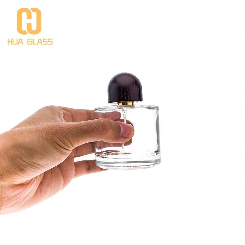 Frasco de perfume de vidrio redondo pequeño de 50 ml y 100 ml con tapa de madera  