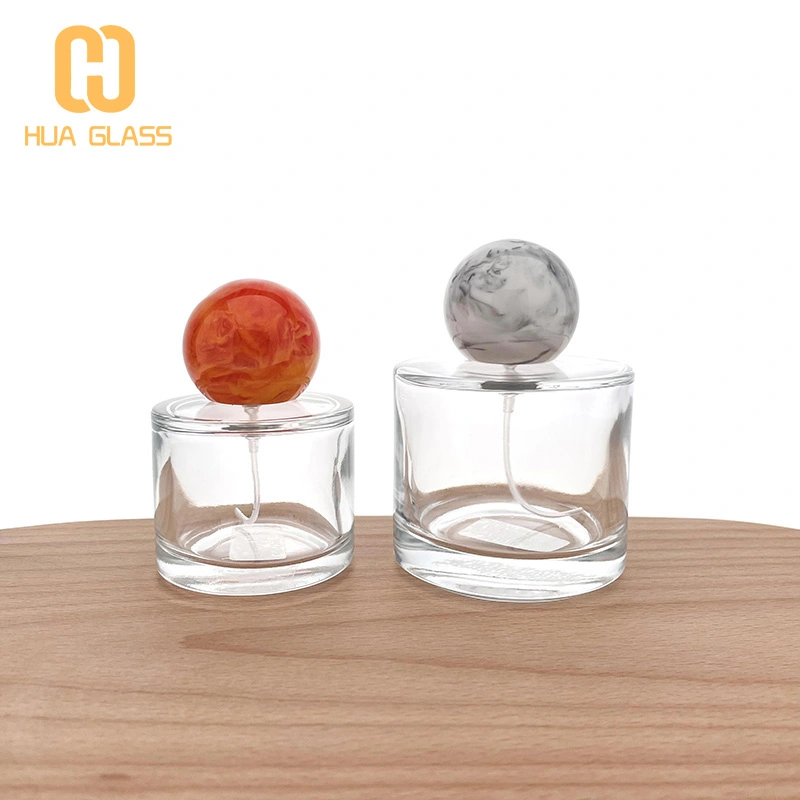 50 مل 100 مل زجاجة عطر زجاجية صغيرة مستديرة مع غطاء خشبي مستدير