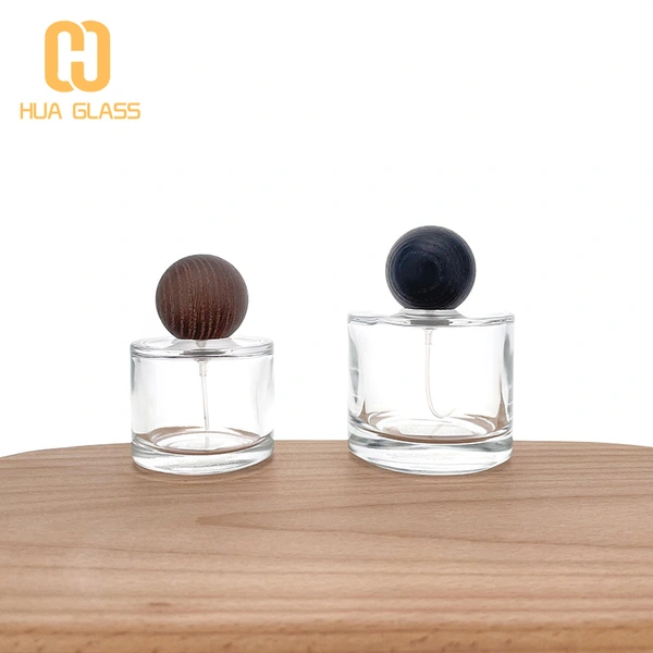 50 مل 100 مل زجاجة عطر زجاجية صغيرة مستديرة مع غطاء خشبي مستدير