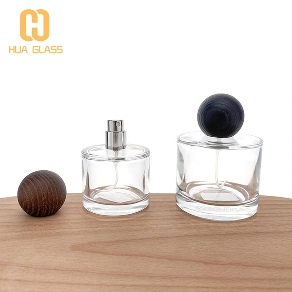 50 مل 100 مل زجاجة عطر زجاجية صغيرة مستديرة مع غطاء خشبي مستدير