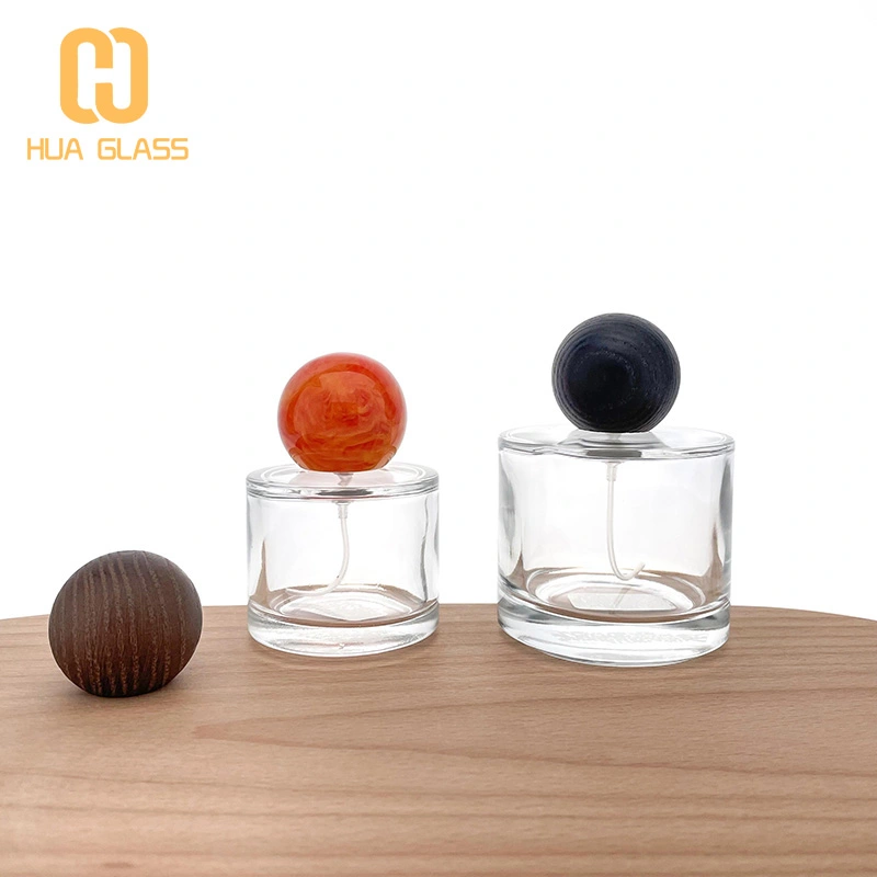 50 مل 100 مل زجاجة عطر زجاجية صغيرة مستديرة مع غطاء خشبي مستدير